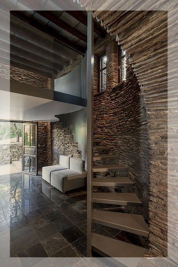 Old stone house refurbished into a contemporary space