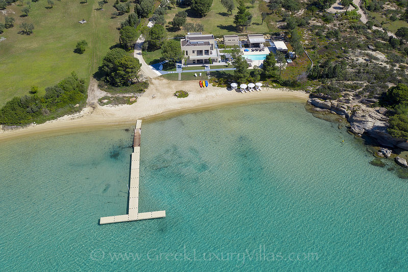 modern beachfront villa with jetty