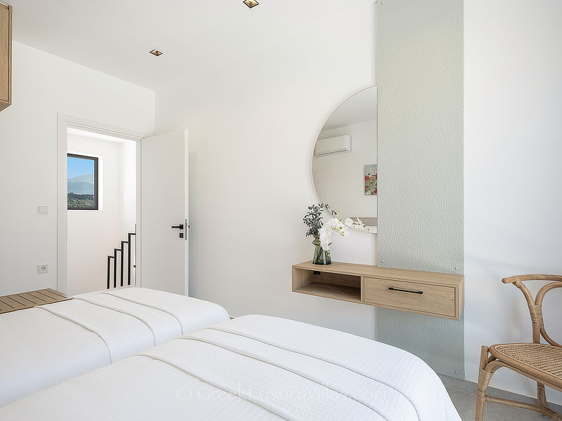 luxurious bedroom of villa with pool in Greece for holiday rentals
