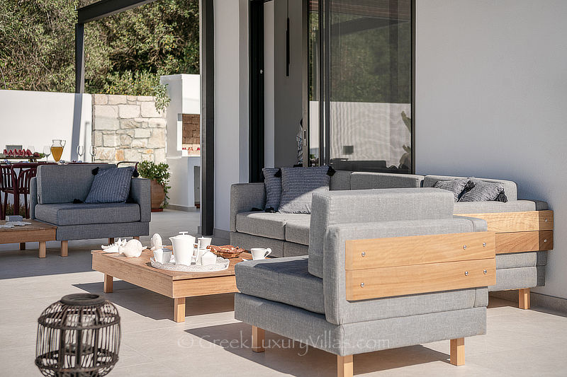 outdoor lounge of villa with private pool and garden for holiday rental