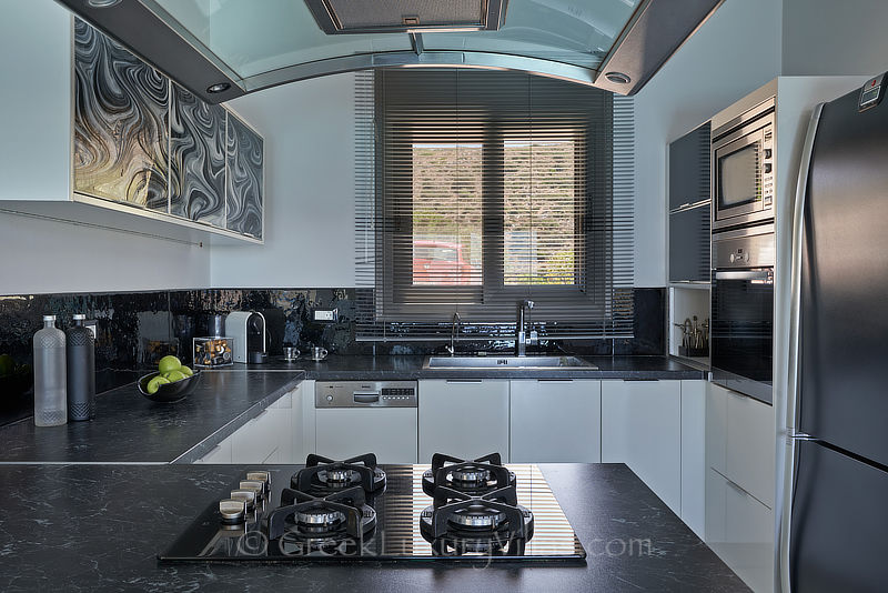 modern kitchen of luxurious villa with heated pool in elounda Crete