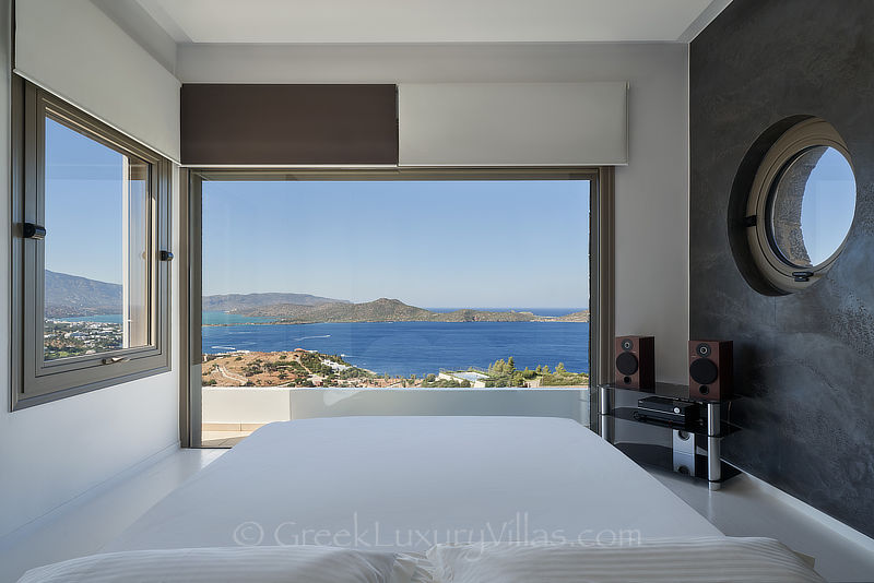 sea view from bed of modern luxury villa with heated pool in elounda Crete