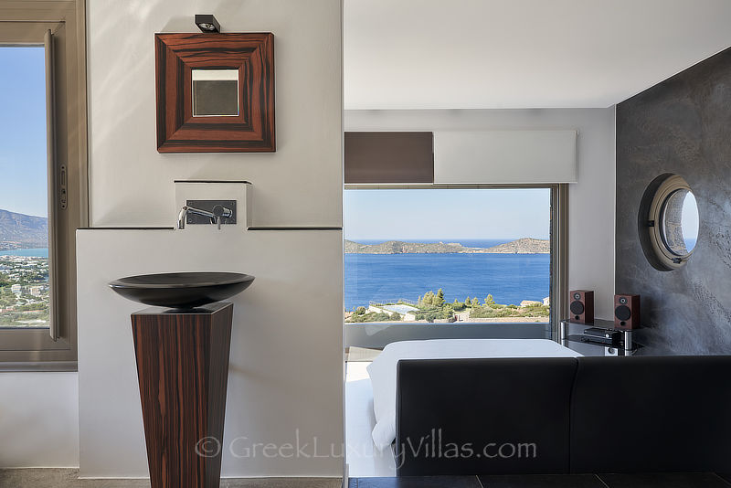 stylish master bedroom of modern luxury villa in elounda bay crete