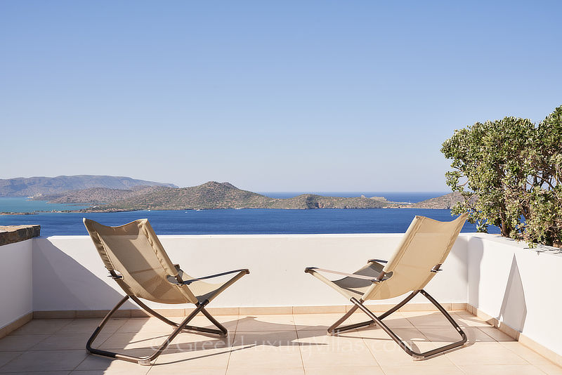 sea view from master bedroom of villa with heated pool overlooking elounda bay