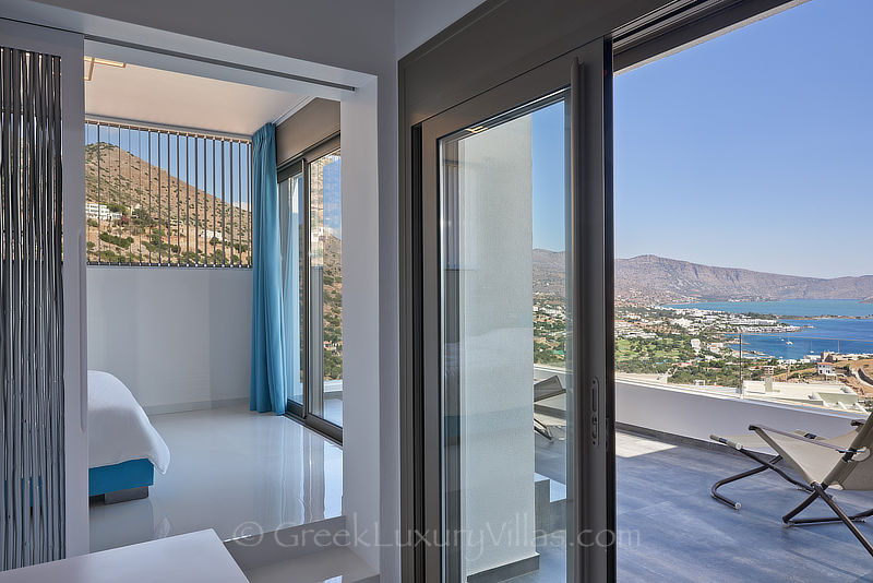 sea view from bedroom of modern luxury villa with heated pool in elounda