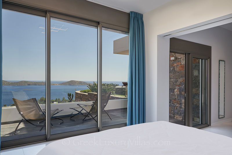 sea view from bedroom of modern luxury villa with heated pool in elounda