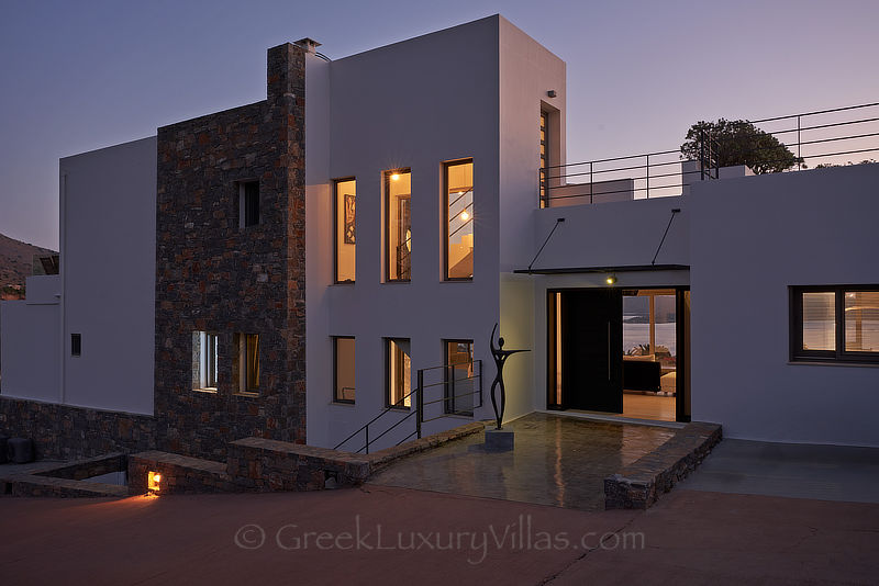beautifully lit modern luxury villa with heated pool overlooking elounda bay Crete