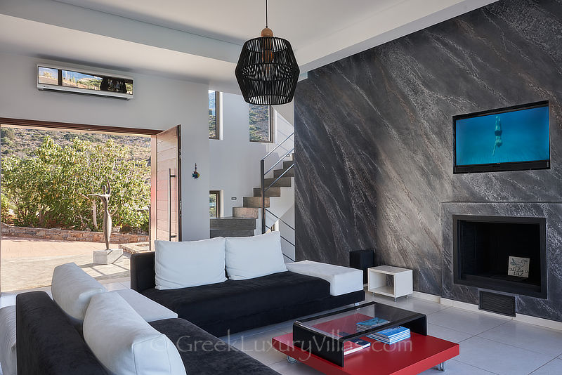 spacious lounge of villa with pool in elounda bay