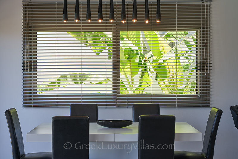 stylish dining area of luxury villa with heated pool in elounda Crete