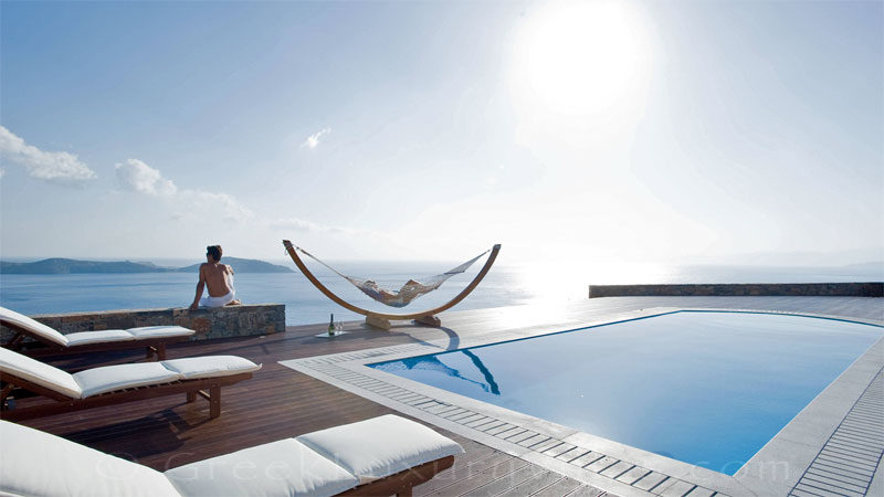 Seaview from a modern luxury villa with a heated pool