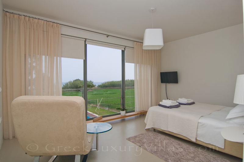 The bedroom of a beachfront villa in Maleme, Crete