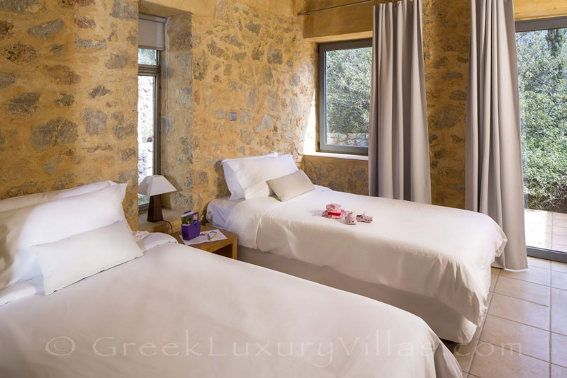 Bedroom of seafront villa with pool in Crete