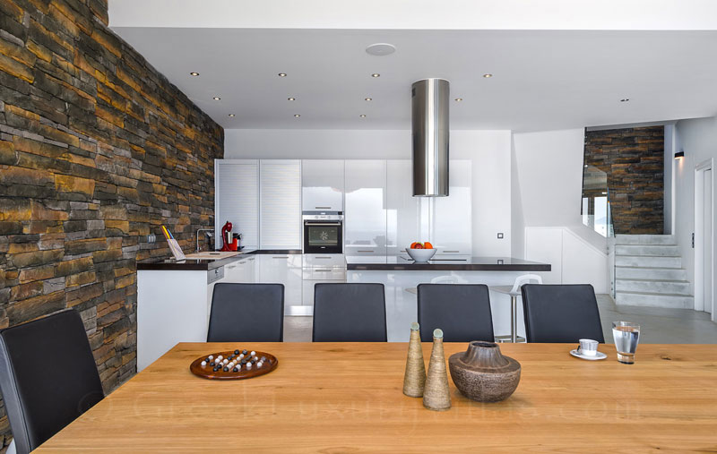 Dining in the kitchen of the seafront luxury villa
