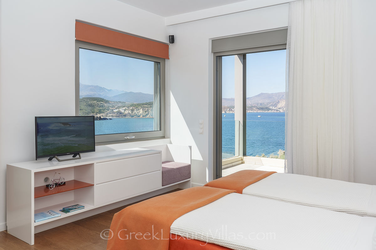 Crete a modern seafront villa bedroom with sea view