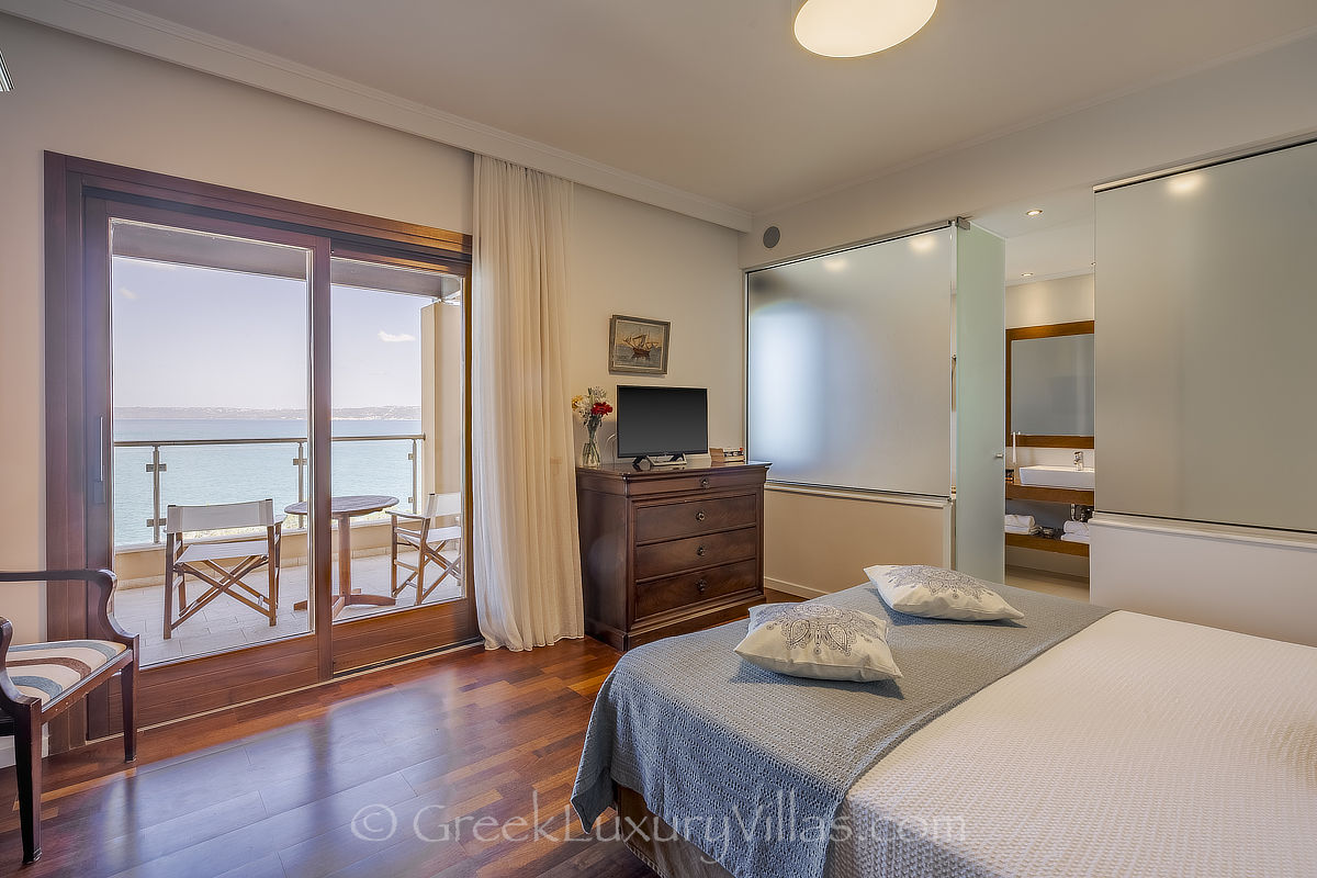 master bedroom sea view of seafront villa with pool