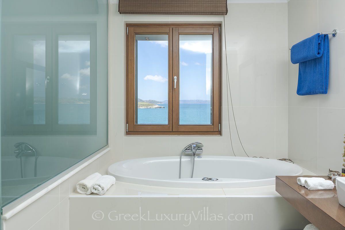 bathroom with sea view in traditional seafront villa with pool