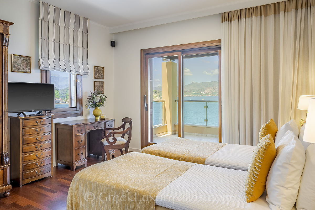 elegant bedroom of seafront villa with pool in Crete