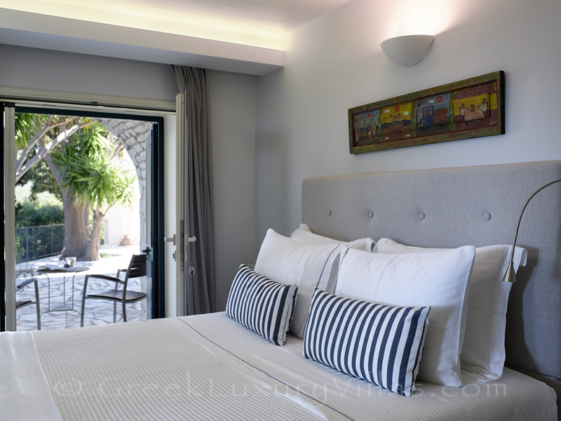 bedroom with access to terrace of luxury villa