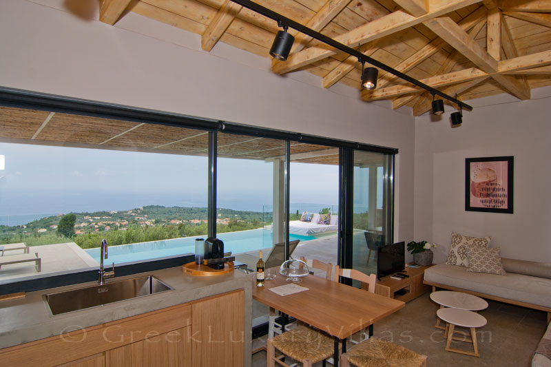 THe lounge of a villa with the seaview and the pool