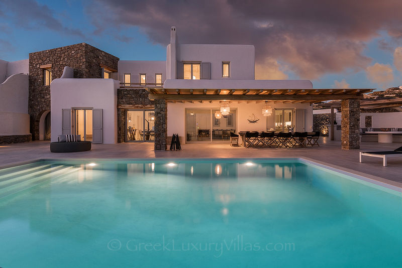 Sunset from luxury villa with pool on Agios Stefanos Beach Mykonos