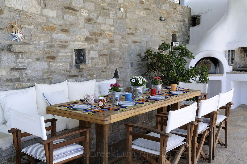 traditional villa with pool side dining area