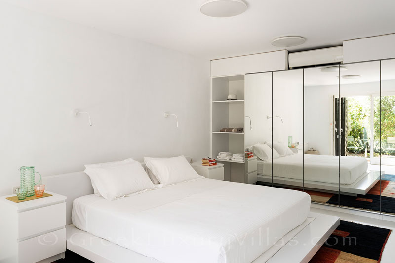 spacious bedroom at beachfront villa with tennis and pool
