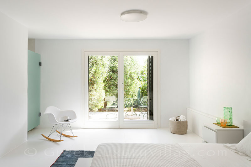 bright bedroom at beachfront villa with tennis and pool