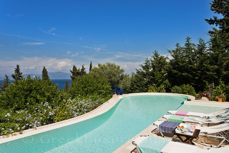 seaview infinity pool at beachfront villa with tennis court