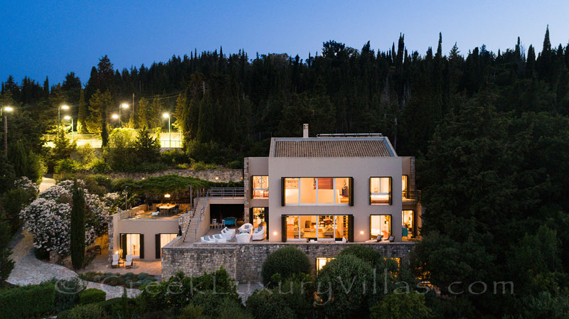 evening at beachfront luxury villa with tennis pool