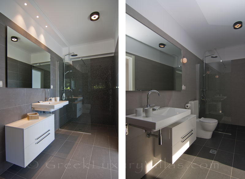 A bathroom of a modern luxury villa with a pool in Paxos