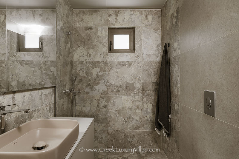 Modern bathroom of beachfront villa with pool