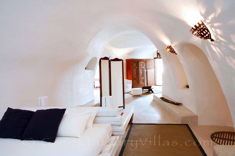 Cave style bedroom of the villa in a traditional village in Santorini