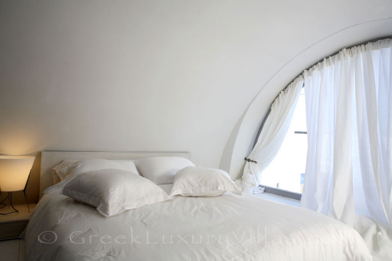 The crater view from the bedroom of a luxury villa in Fira, Santorini