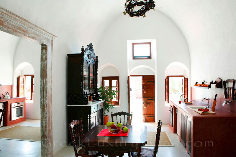 The dining room of a traditional village house with a pool in Santorini