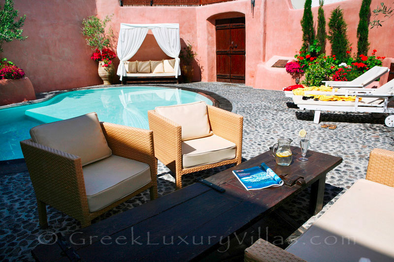 The courtyard of the traditional village house with a pool in Santorini