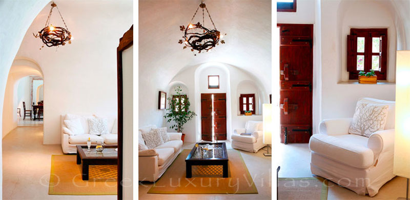 The living room of a traditional village house with a pool in Santorini