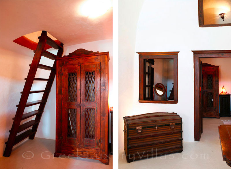A bedroom of a traditional village house with a pool in Santorini