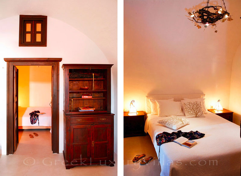 A bedroom in a traditional village house with a pool in Santorini