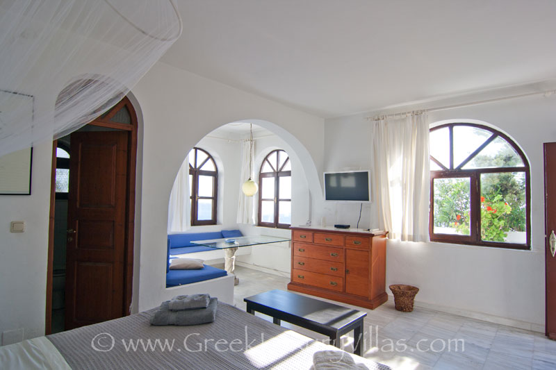 Marble bedroom in a large villa with a pool in Santorini