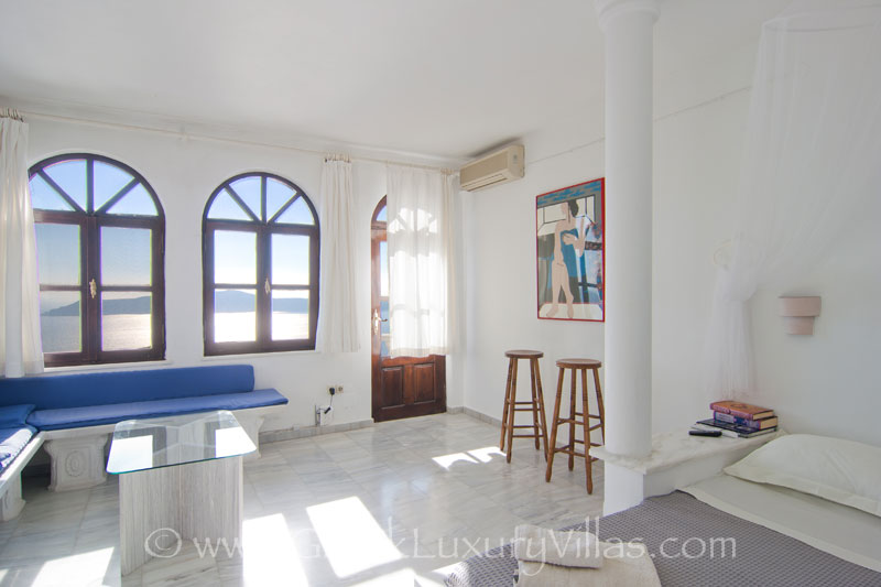 Marble suite bedroom in a large villa with a pool in Santorini