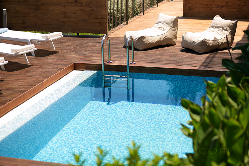 modern holiday villa with pool and sea view sun bathing