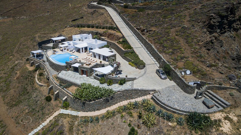 aerial view seafront luxury villa with pool Greece