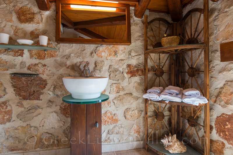 A bathroom of a seafront villa with a pool in Zakynthos