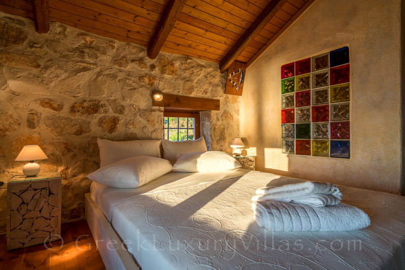 The bedroom in a seafront villa with a pool in Zakynthos